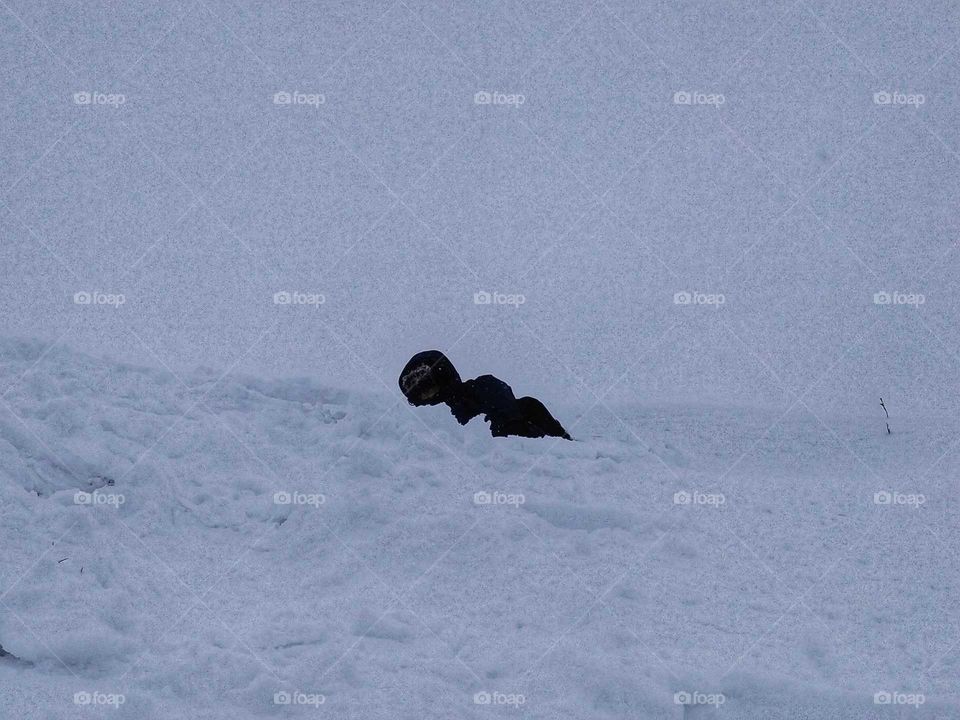 person on the floor in the snow