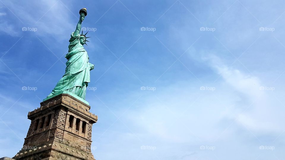 Statue of Liberty under beautiful sky