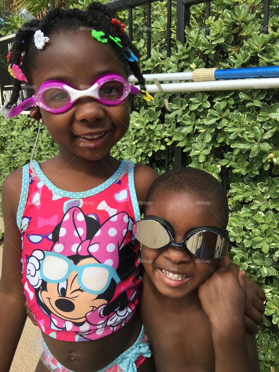 Portrait of African brother and sister with goggles
