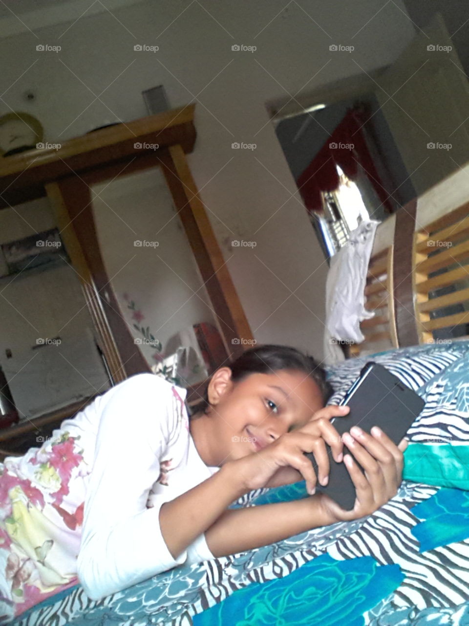 play with the mobile. playing with mobile