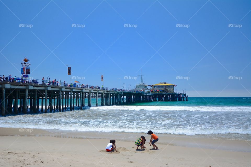 Childern palying on sand at beach