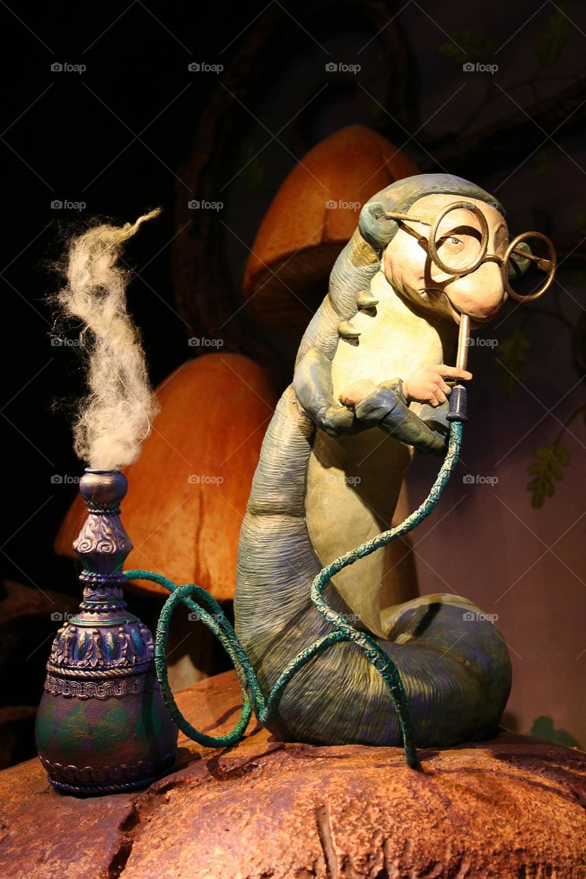 The Caterpillar smoking the hookah in Wonderland.