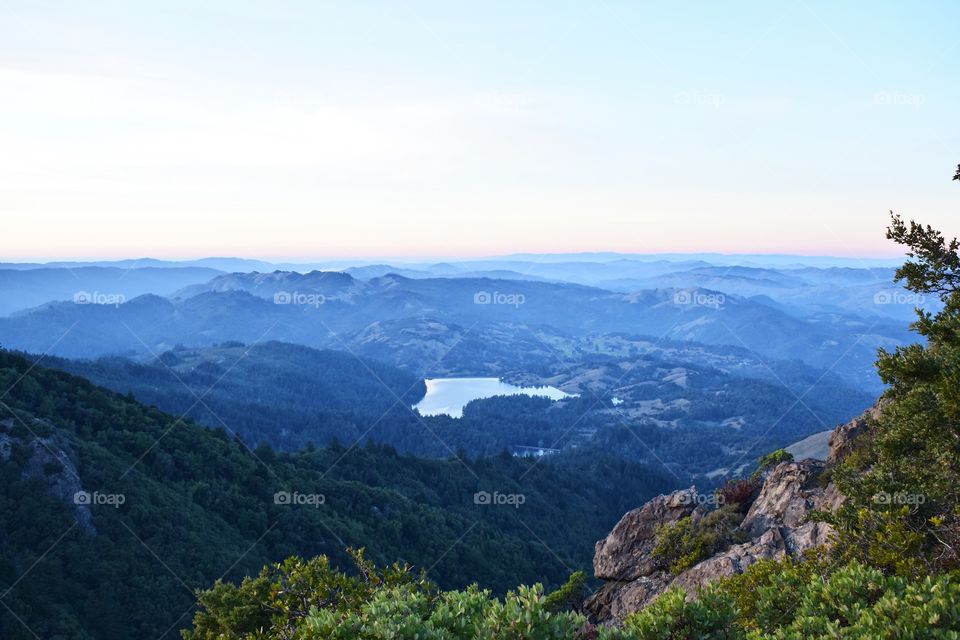 View of mountain range in fog