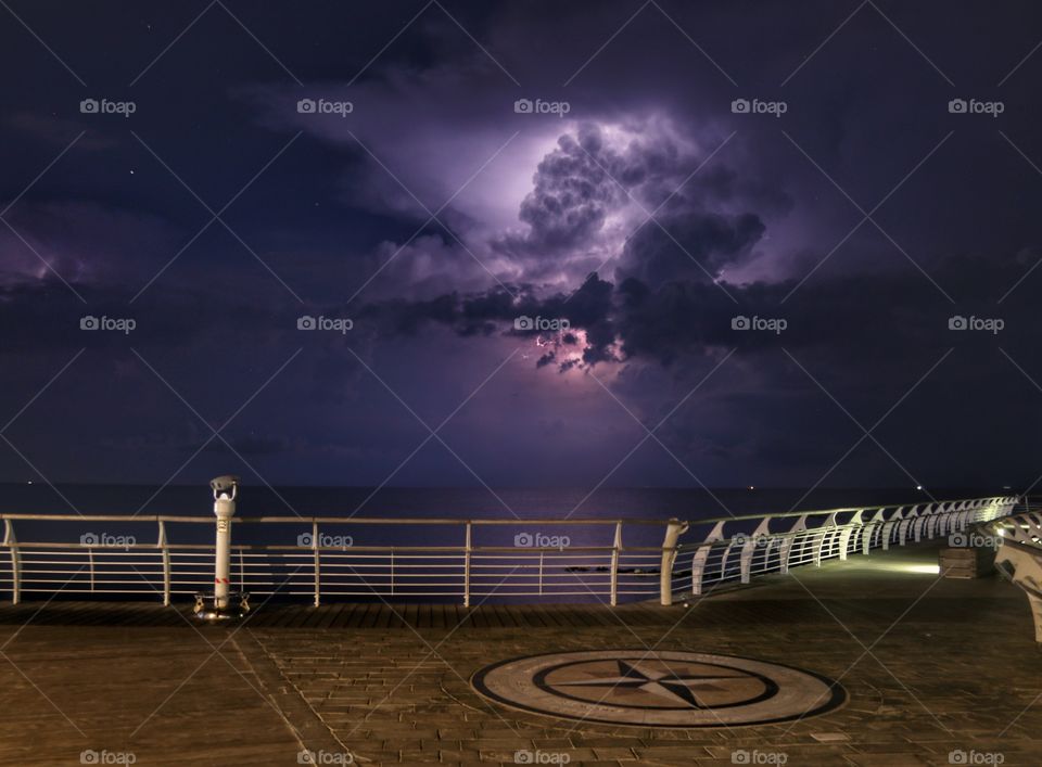 thundercloud over the sea at night