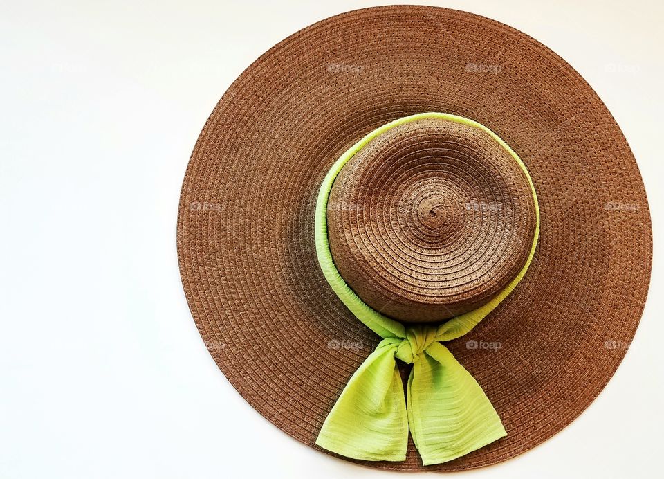 High angle view of hat with green scarf