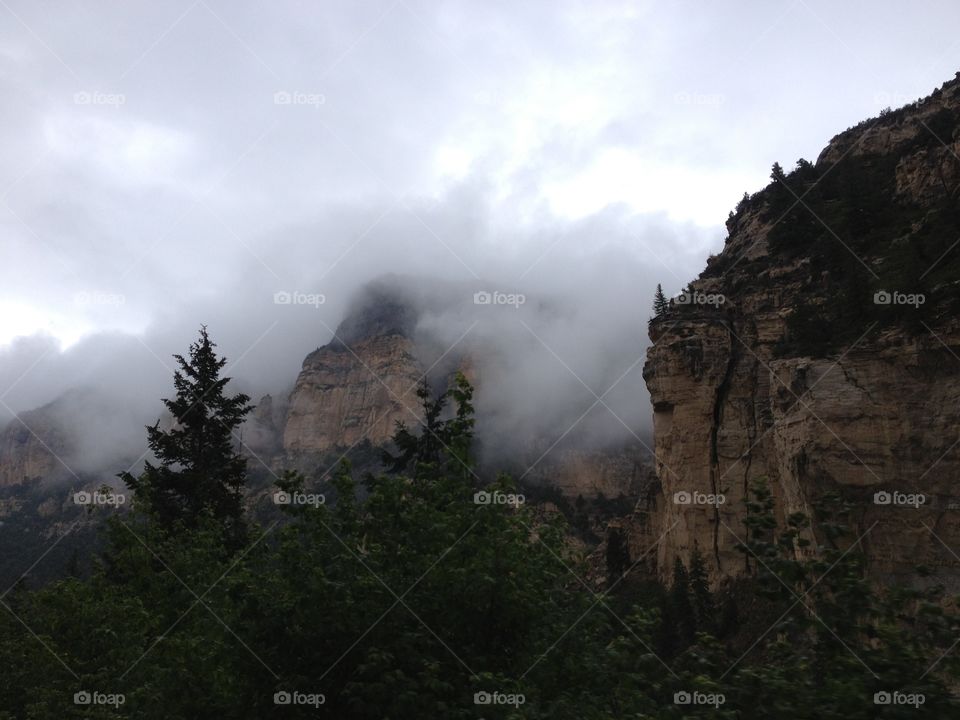 View of mountain in fog