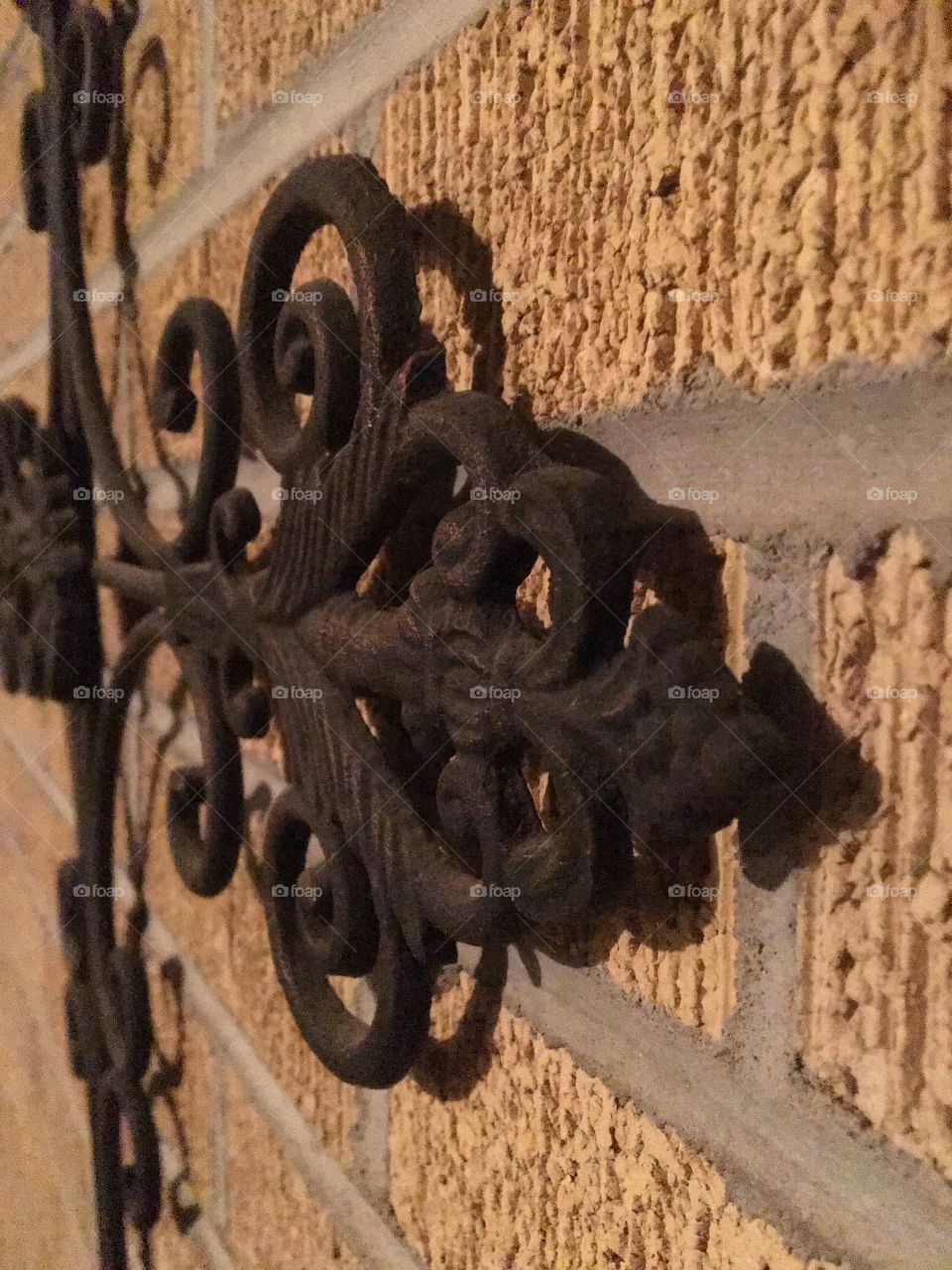 Metal on brick