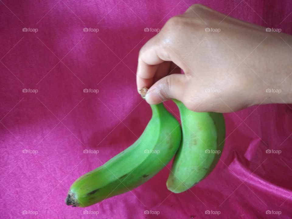 holding hands with food banana