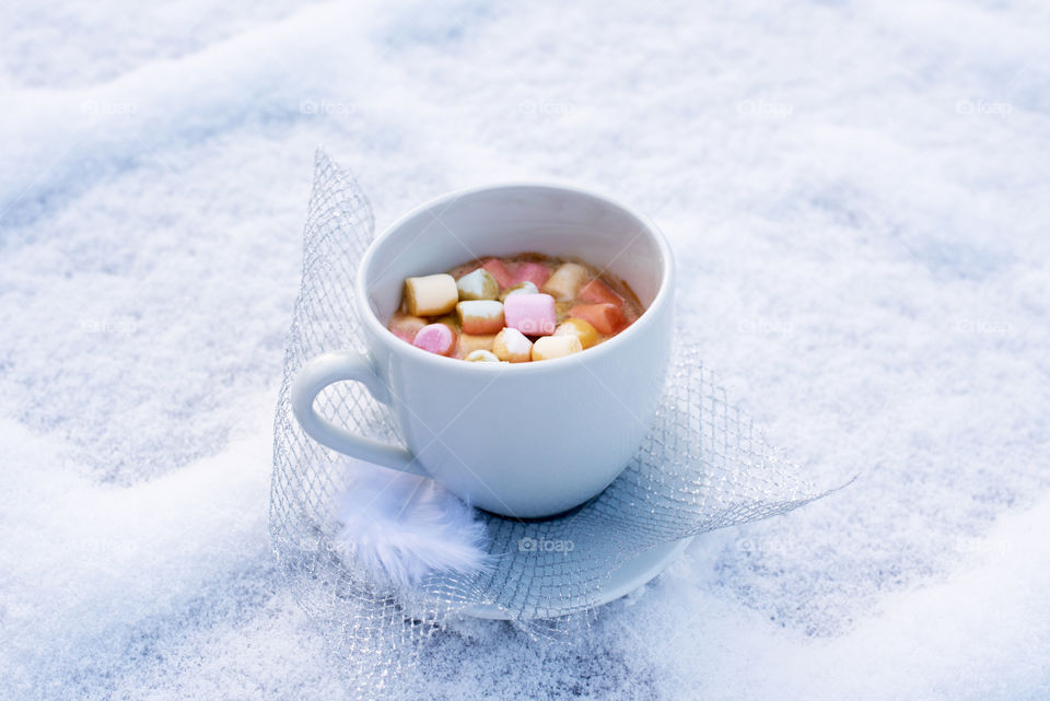coffee with marshmallow on snow