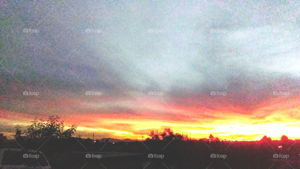 Clouds over  AZ. desert form  beautiful colors at sunset