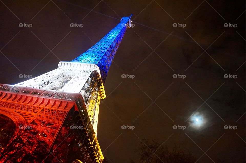 The Eiffel Tower lit up after the Paris attacks, Nov 2015