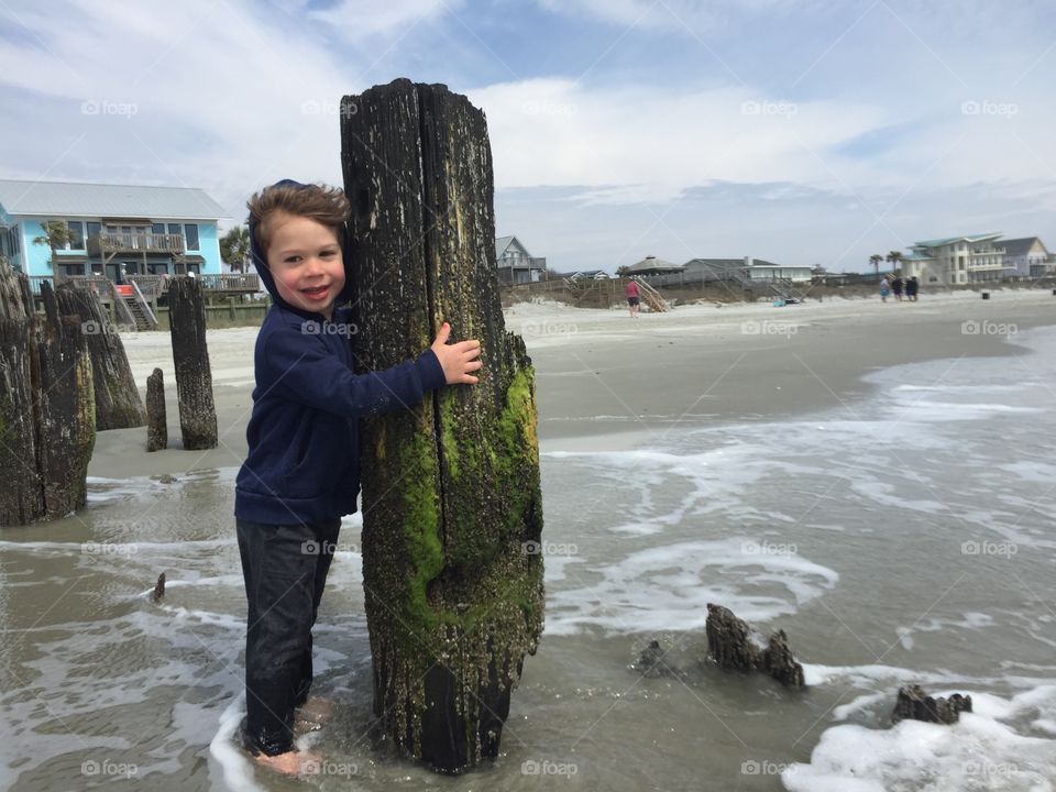 Boy posing on the beach 