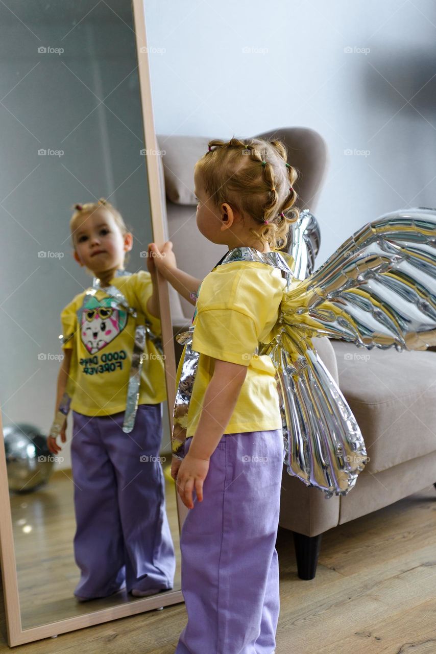 Beautiful girl reflected in the mirror