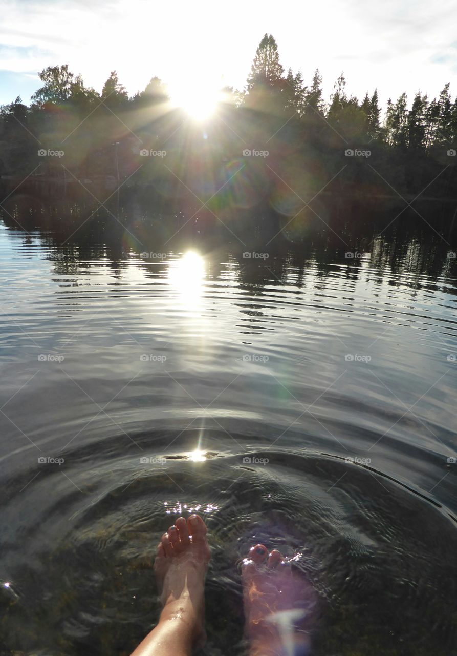 Bathing my feet in a lake in the dawn