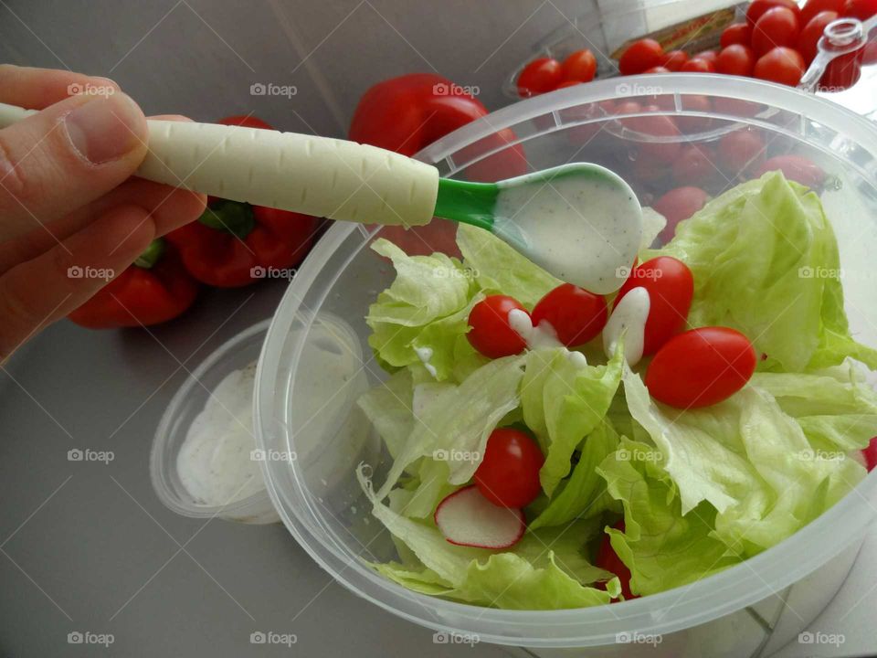 Woman preparing salad