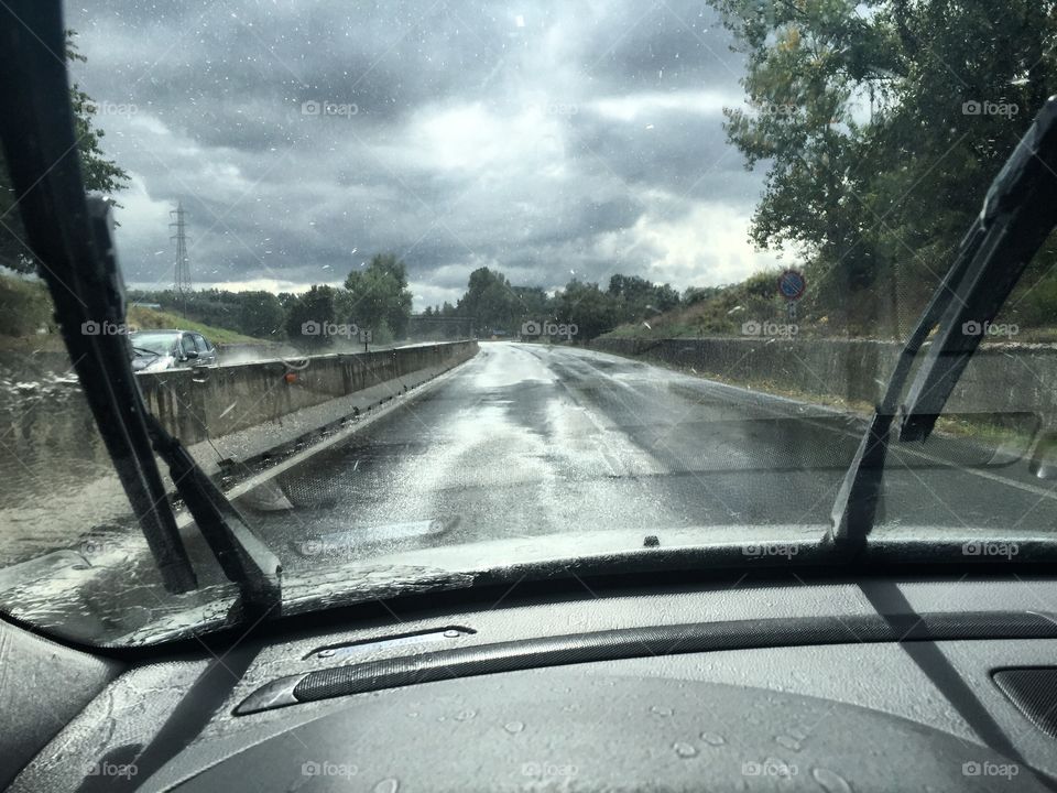 Driving . Car in wet street 