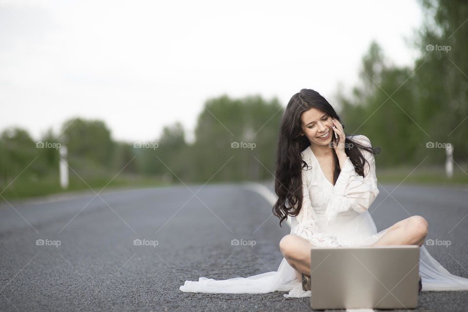 Woman on asphalt rural road