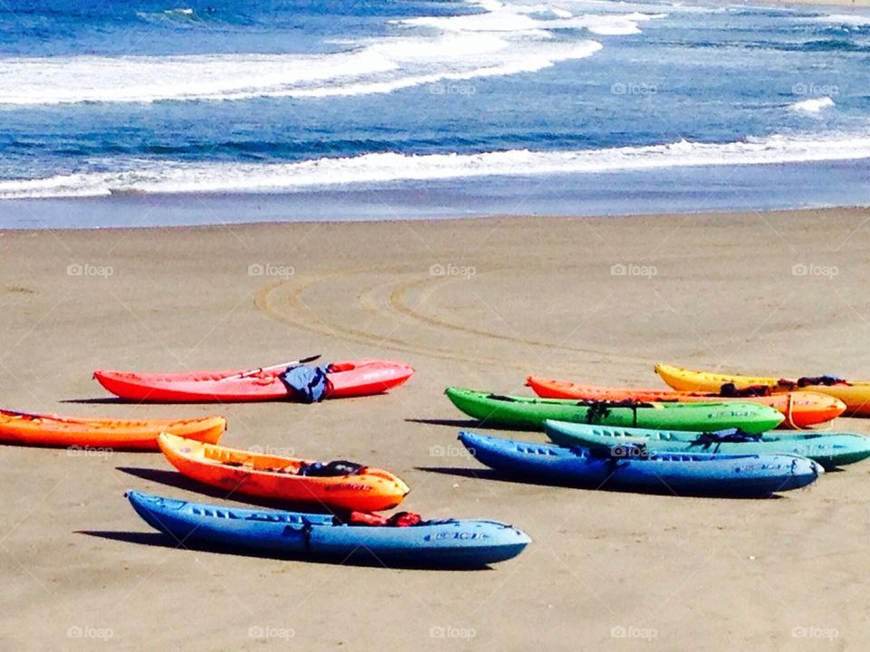 Bright canoes on the beach