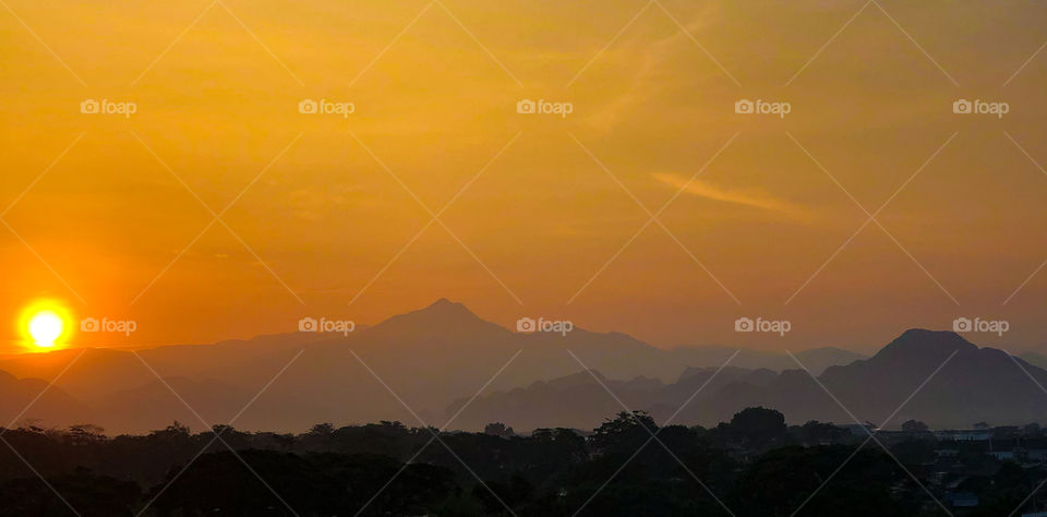 Sunrise early morning behind the hills