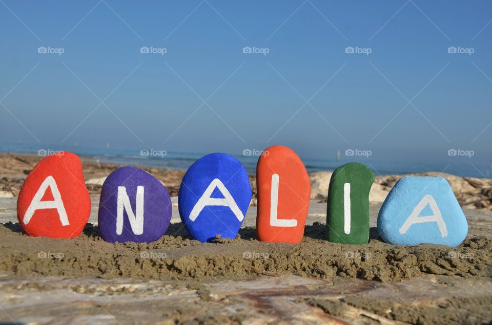 Analia, female name meaning merciful on colourful stones