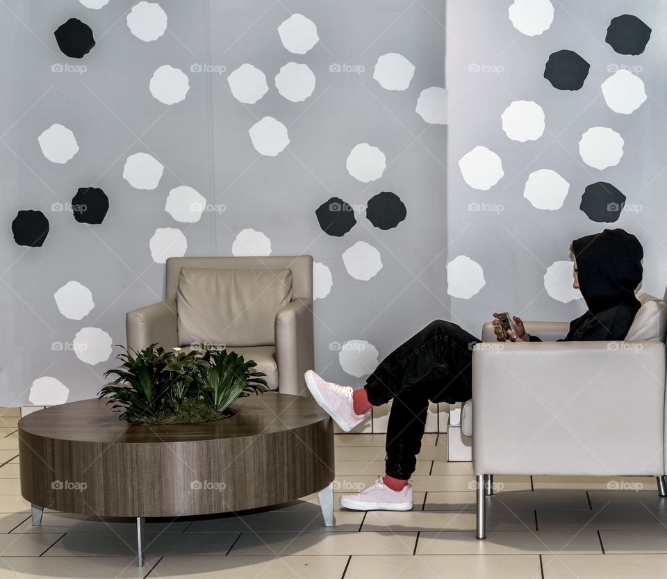 Cool kid sitting in a room of circles 