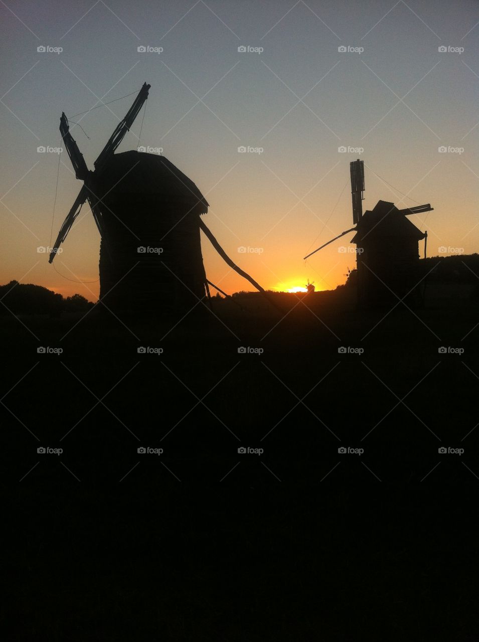 Windmills on the sunset sky 