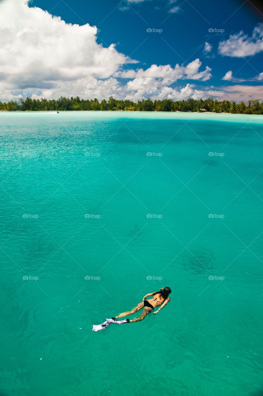 Snorkeling off private dock at Fourseasons Bora Bora