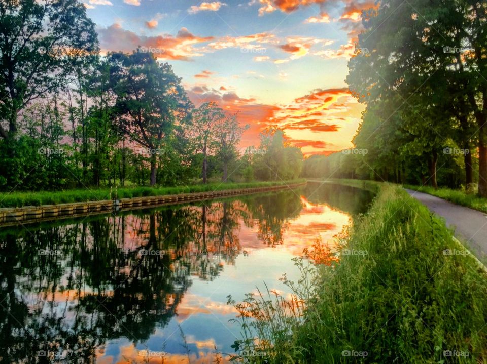 Reflected colors of the sunset in the water of a river