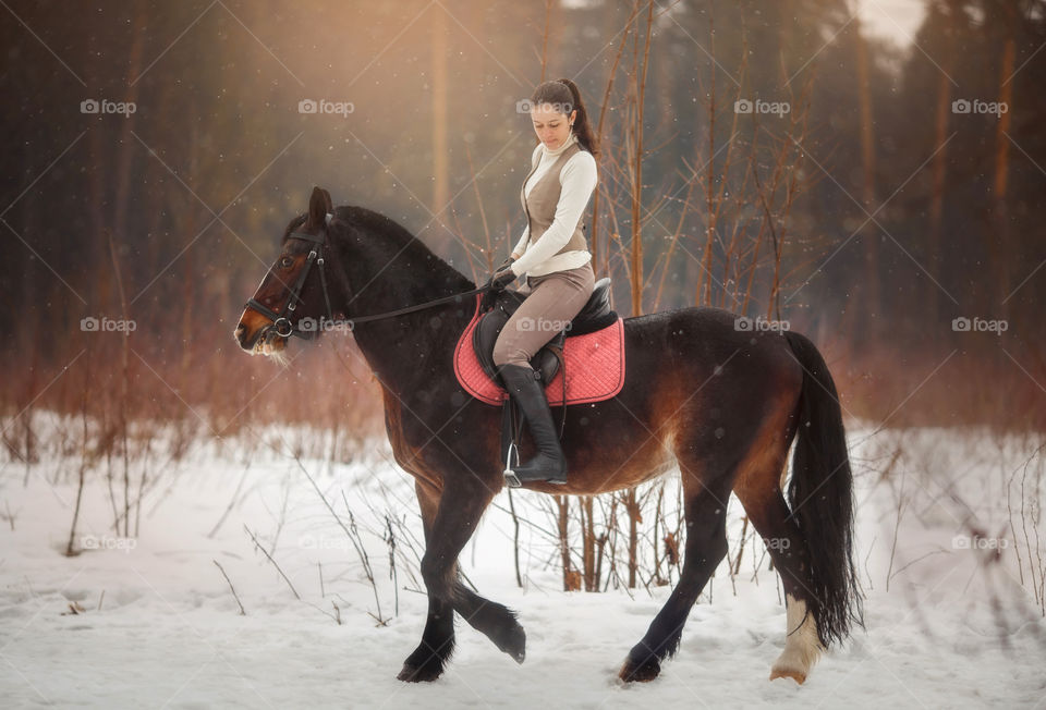 Young beautiful woman with horse outdoor portrait at spring day