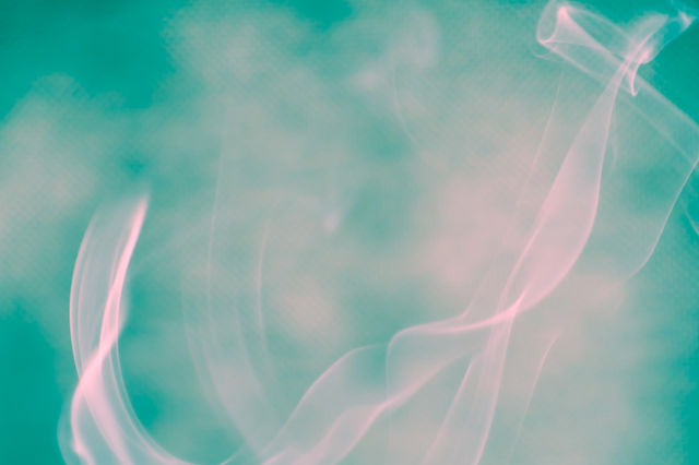 Smoke scented candles on a black background