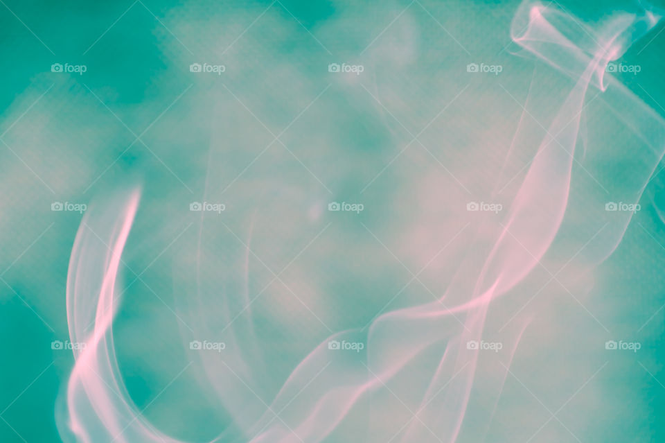 Smoke scented candles on a black background