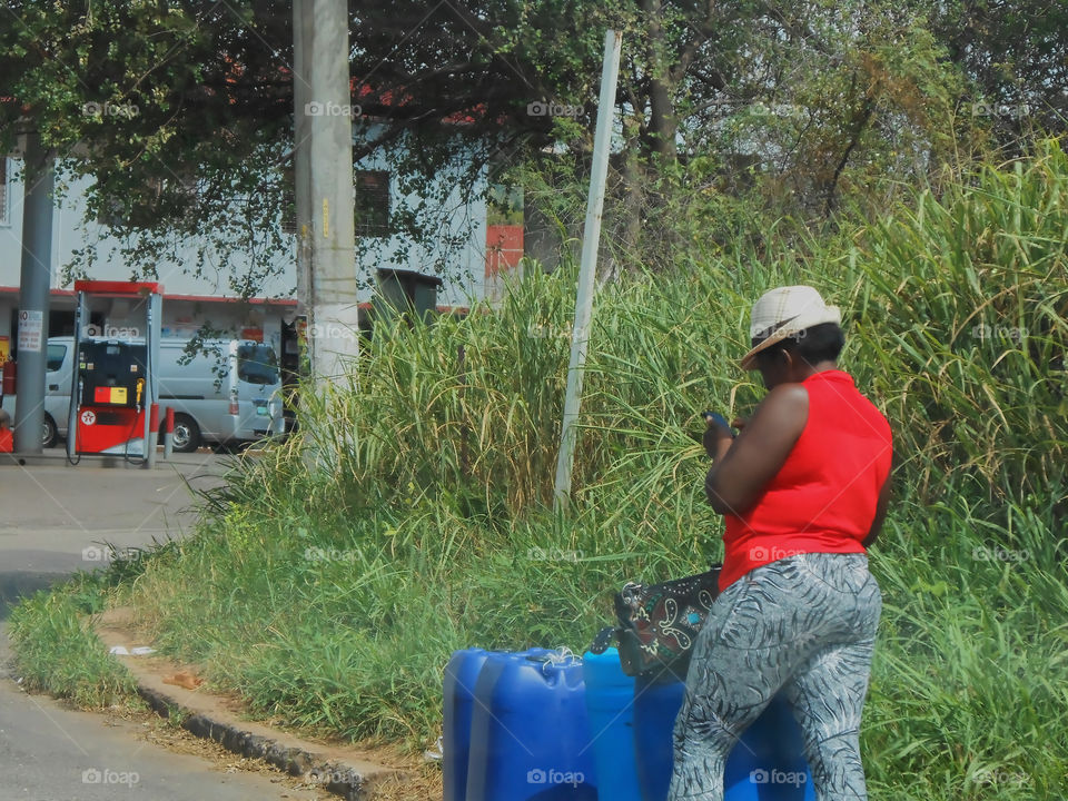 Standing at the Curve Reading From Phone