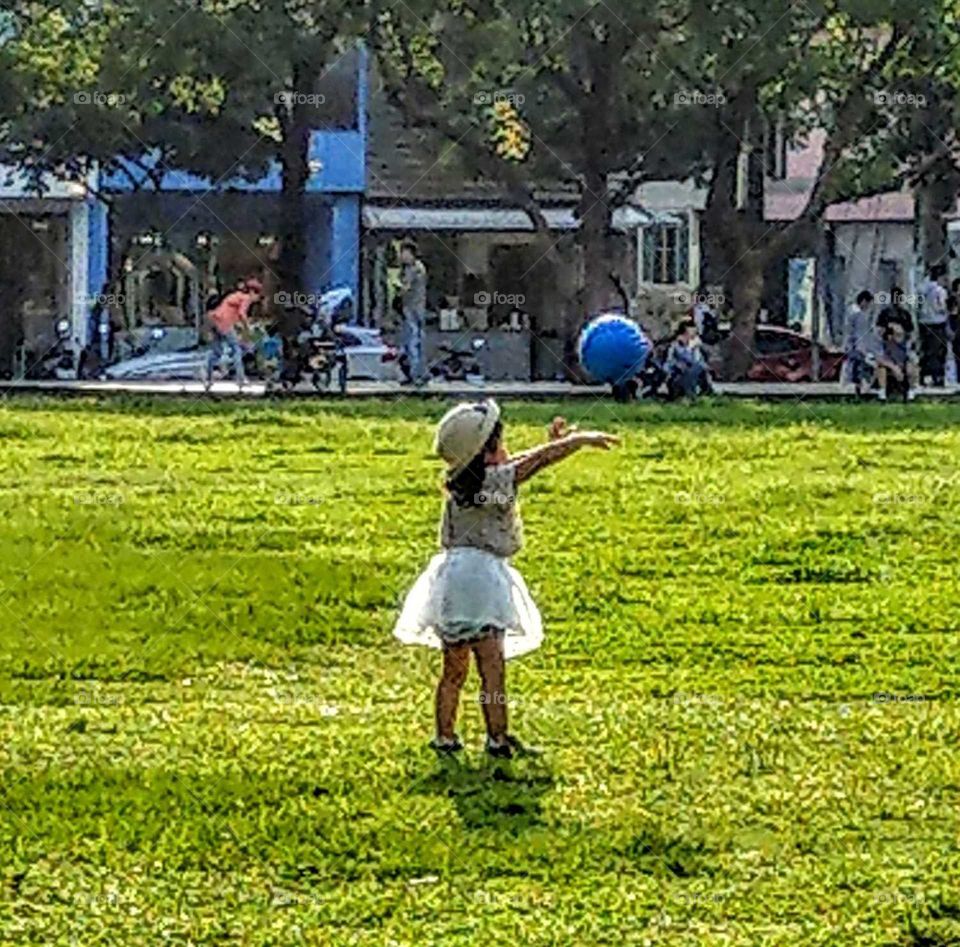 staying in good shape: girl playing with a ball