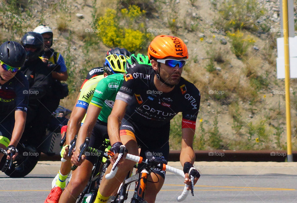 U S Pro Challenge bicycle race. 5 leaders round the corner leaving Buena Vista for Fairplay