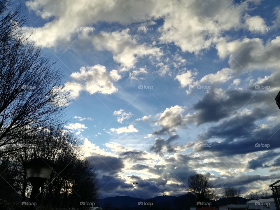 Sunset. Clouds on a blue sky