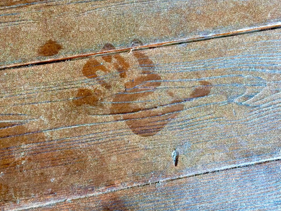 Hand print on wooden table