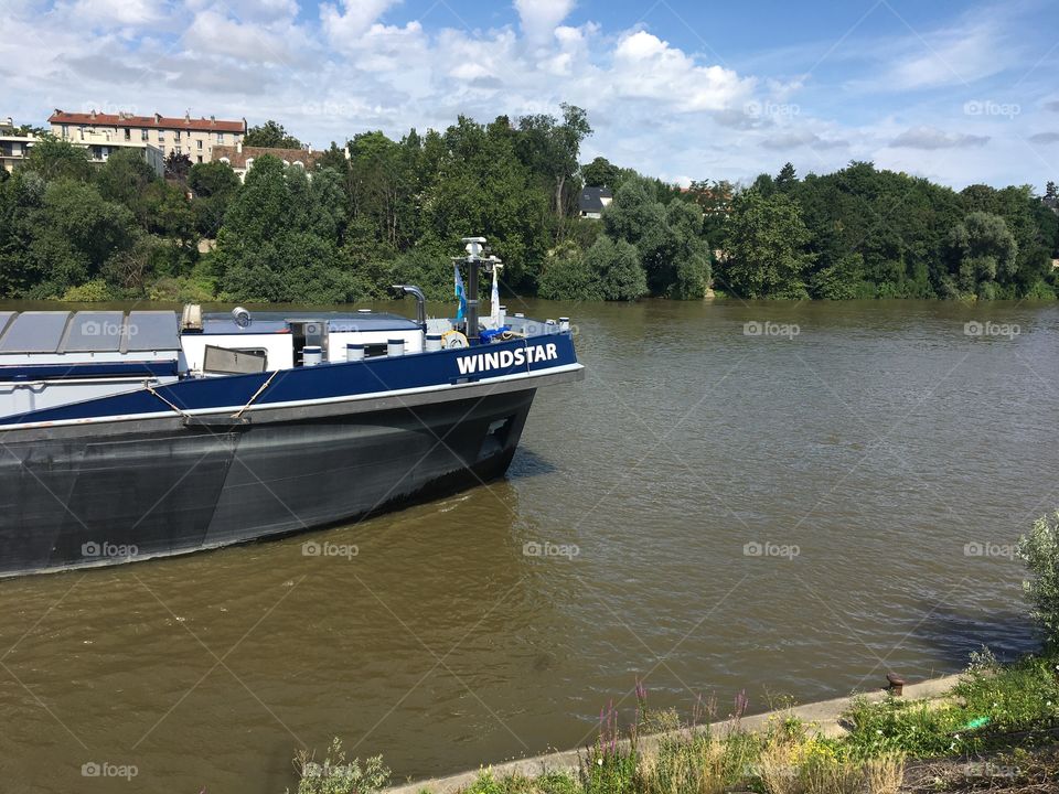 Barge traveling on the river