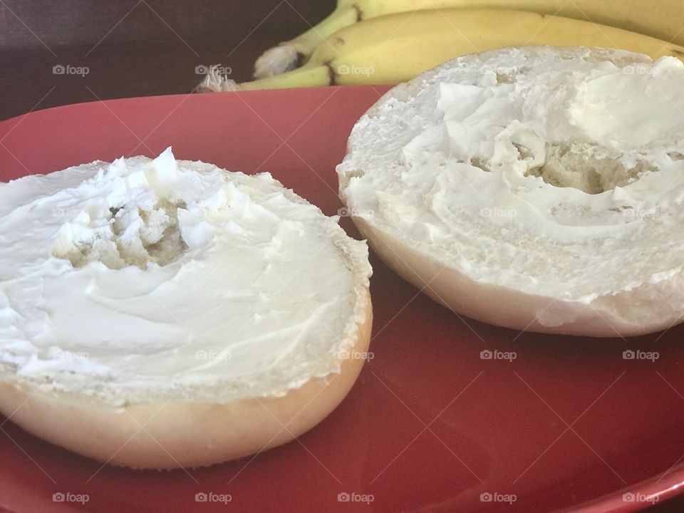 Two bagel halves Bagels with cream cheese 