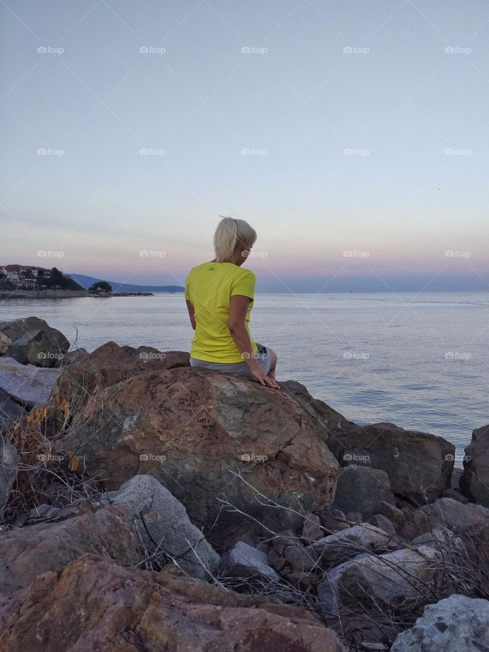 Girl relaxing on the sea coast