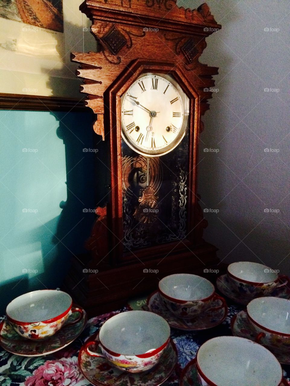 Tick Tock. Antique clock and tea cups