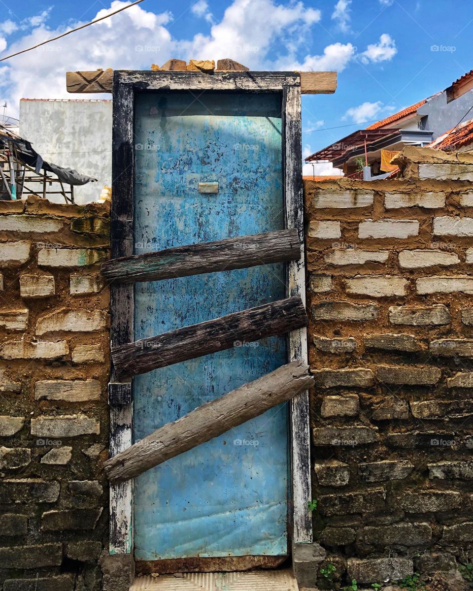 blue door and the bricks 