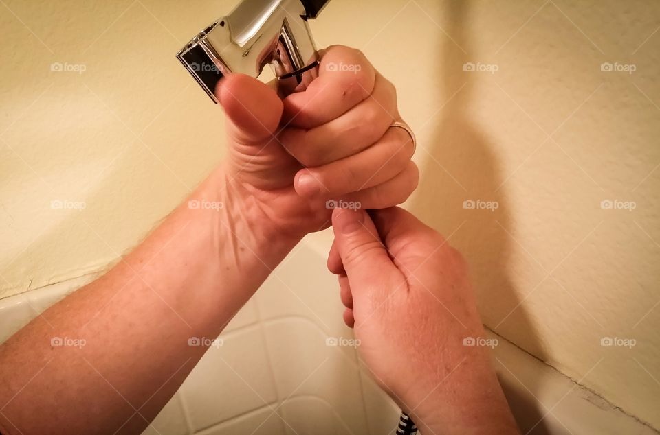 Plumber working on shower head