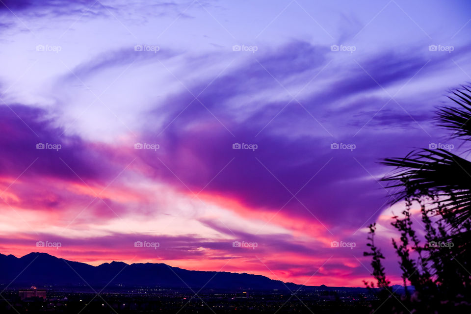 Glamorous twilight over the mountain range in Las Vegas Valley yesterday afternoon. I love it when all the clouds swirl into a pattern and paint the entire sky.