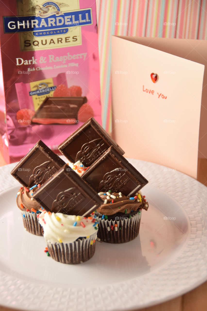 Gira deli chocolate squares on top of miniature cupcakes, tabletop presentation