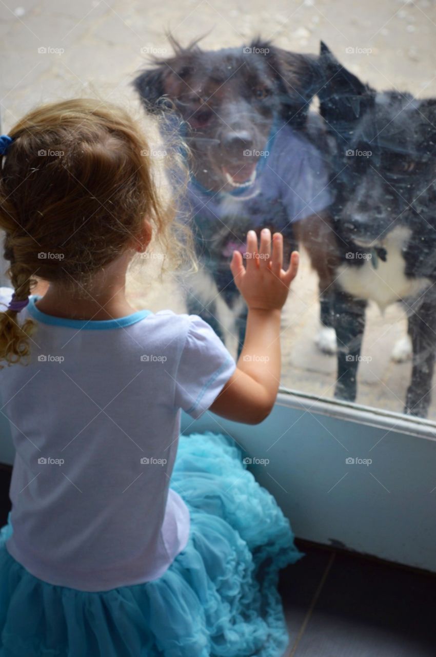 Little one looking through the window
