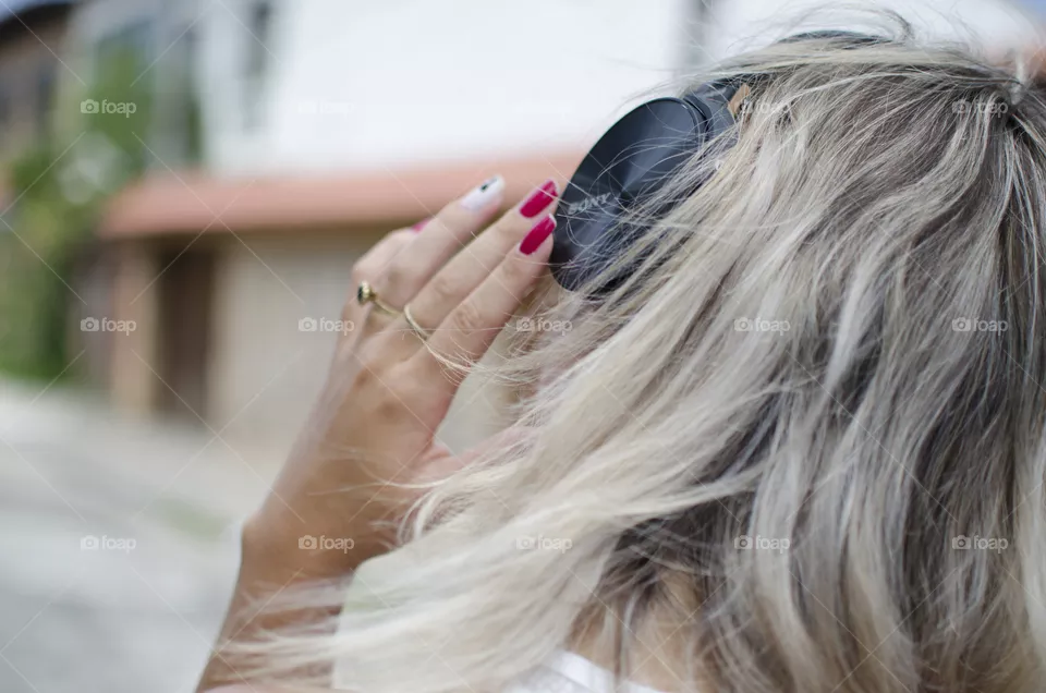 Woman listening to music on headphones