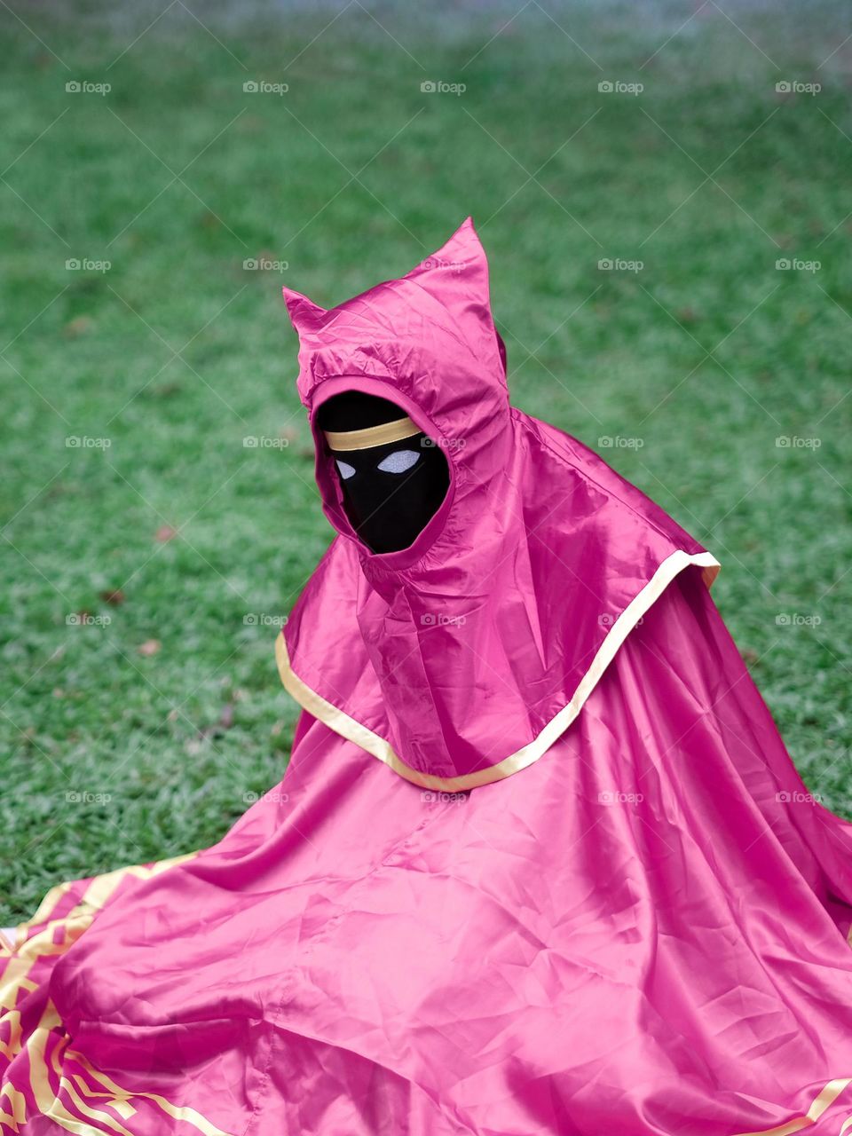 An Anime character sitting on grass at a manga festival in KL