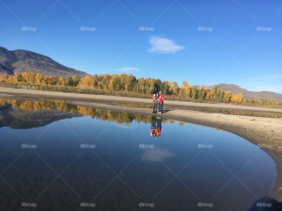 Family reflection in the river