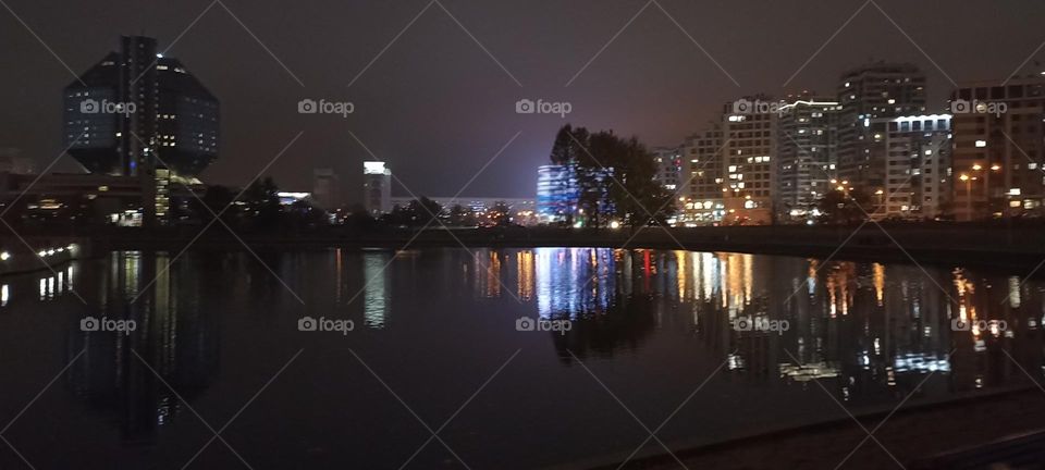 beautiful night light street view, windows magic light, cityscape and reflection in river