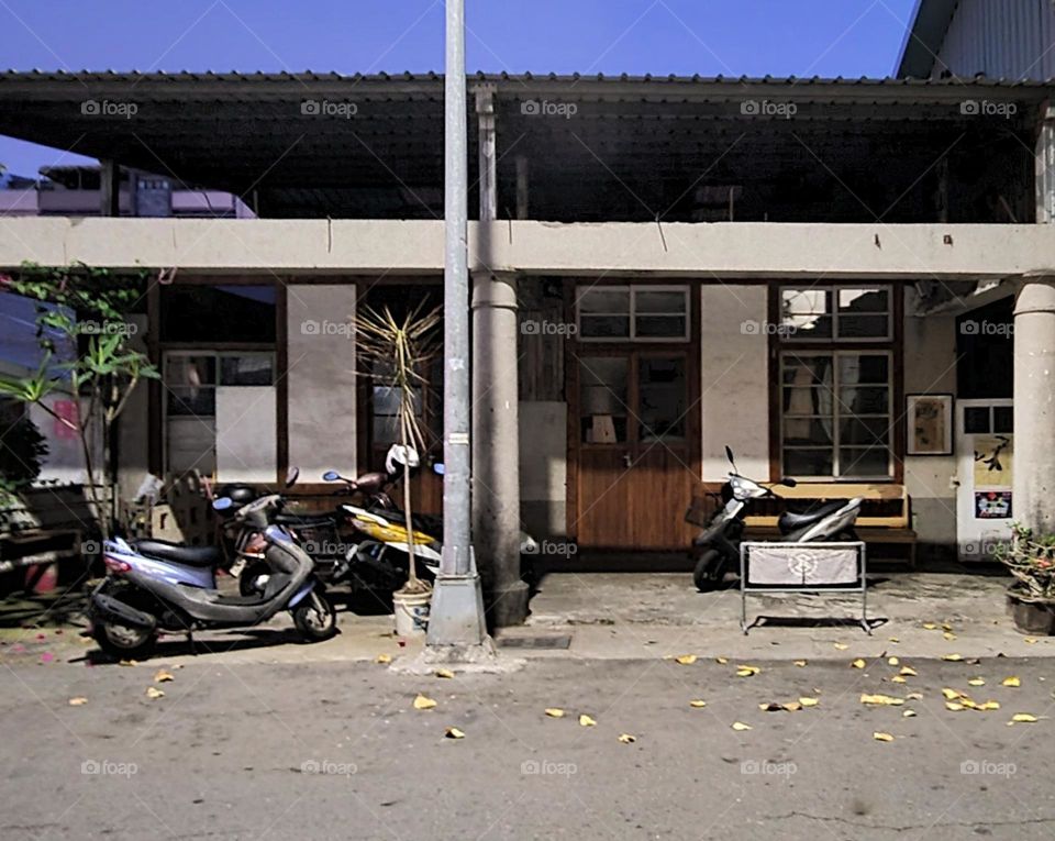 motorcycle parked outside historic building